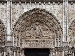 Central tympanum of the Royal portal, Chatres Cathedral, 1145-50. The "Majestas Domini" in the typmanum of the Main potral of the Chartres Cathedral is usually called a "Last judgement" as the symbols of the four evangelists are often interpreted as the four beasts of the apocalyse although the title would be more obvious if the Lord was seated on a rainbow as mentioed in Old Testament phrofit's vision. 